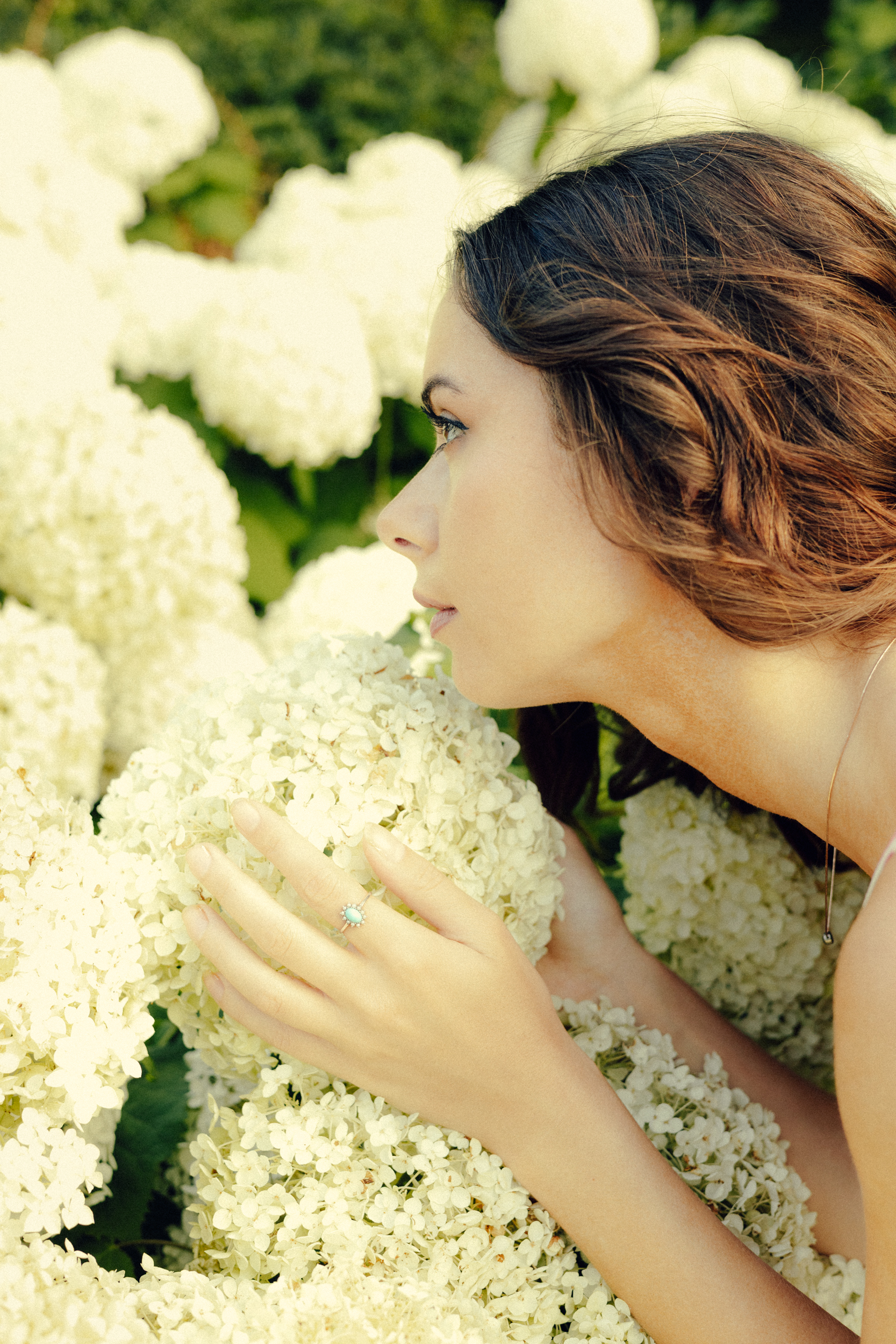 woman smelling flowers