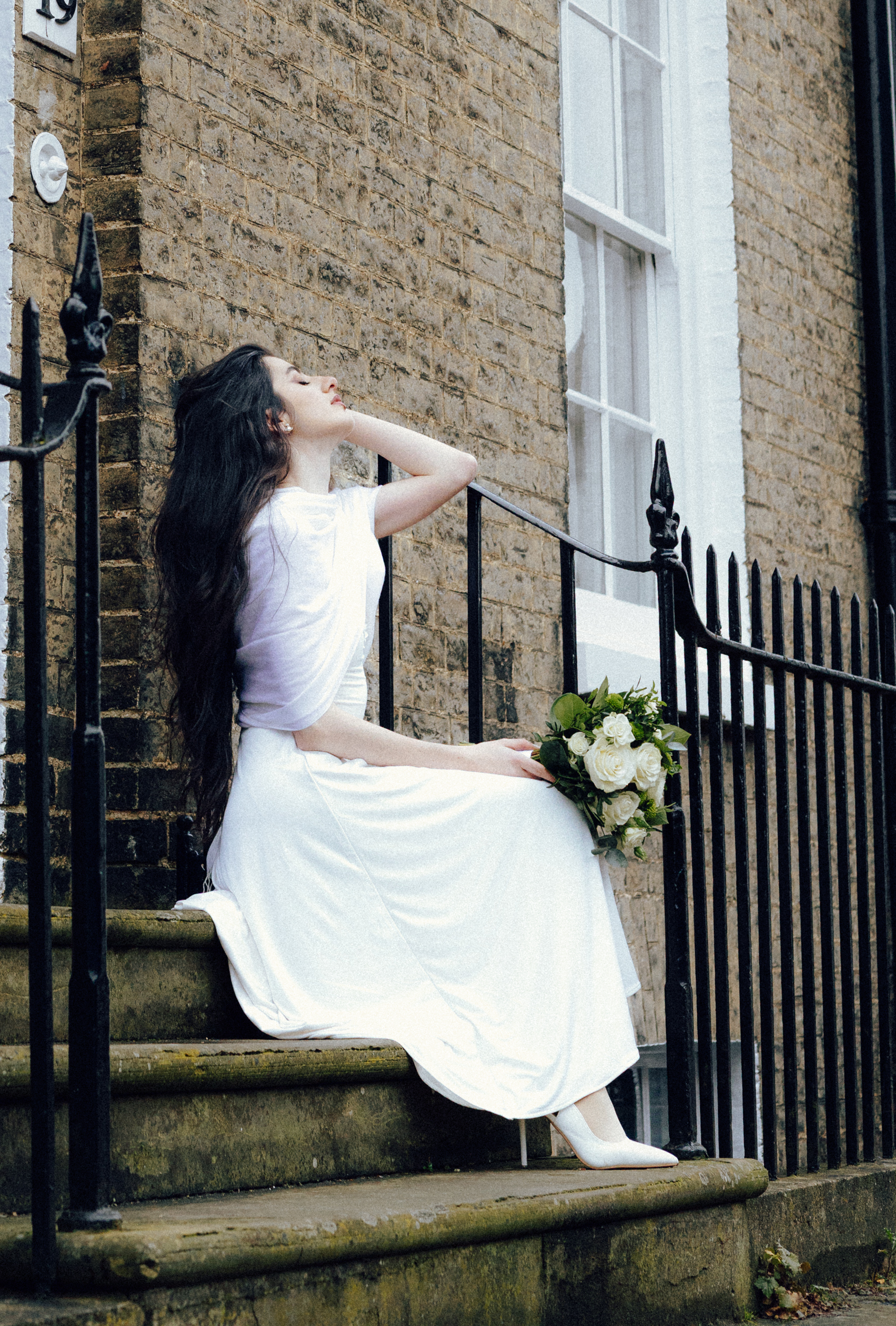 bride sitting on stairs
