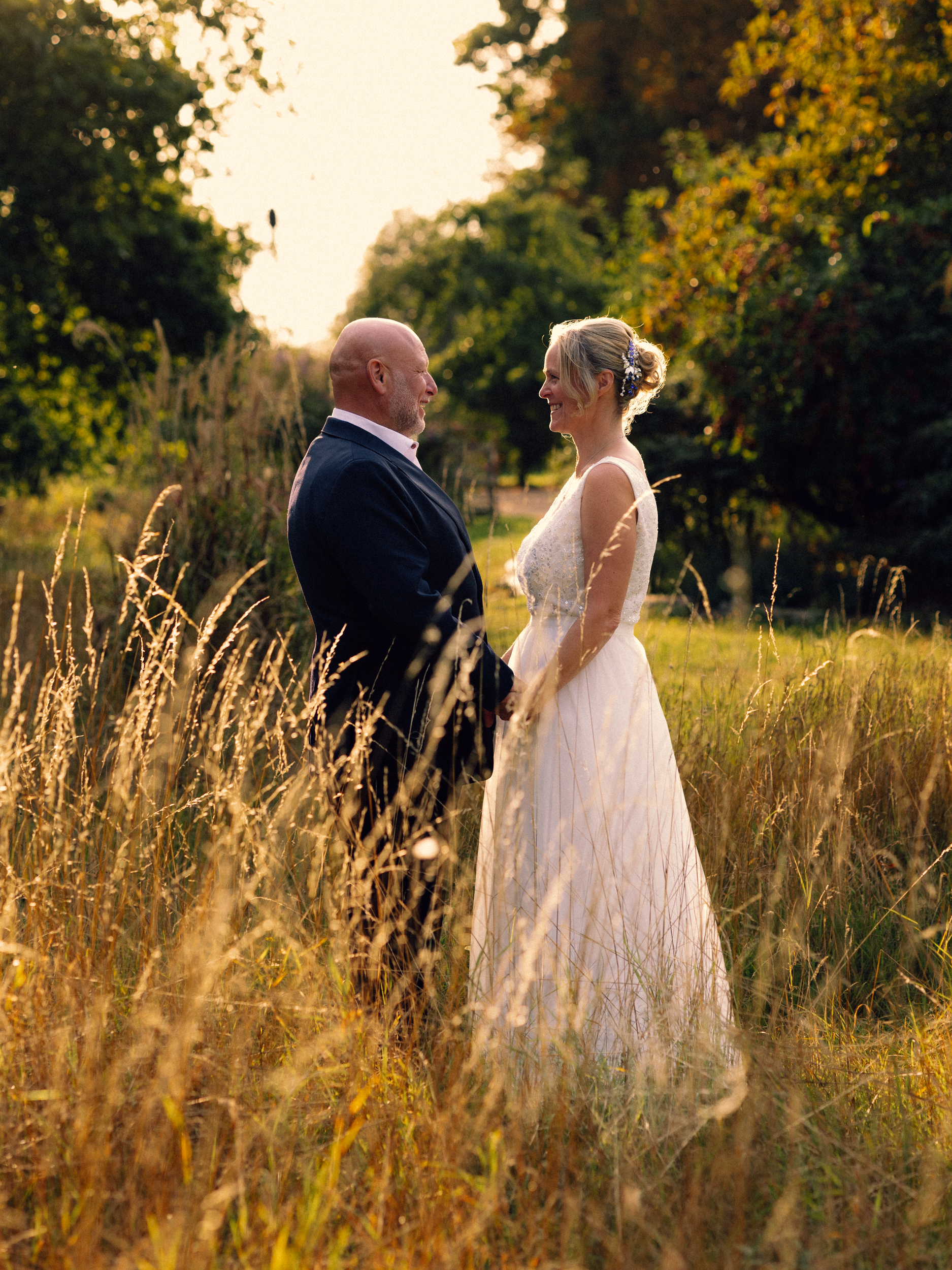 bride & groom portrait at sunset in a field
